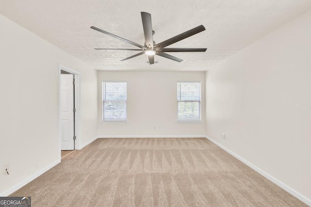 1186 Hawthorn Ln, Grayson, GA 30017 - spare room with ceiling fan, carpet floors, and a textured ceiling
