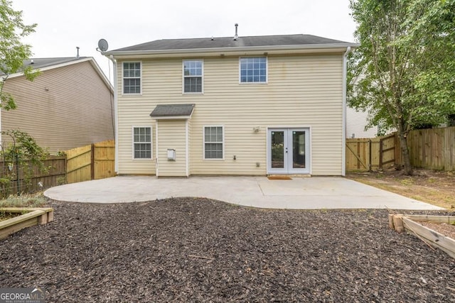1186 Hawthorn Ln, Grayson, GA 30017 - back of house with a patio area, a fenced backyard, and french doors