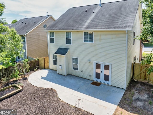 1186 Hawthorn Ln, Grayson, GA 30017 - rear view of property featuring a patio, a fenced backyard, and a shingled roof