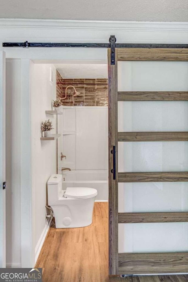 2572 Bates St SE, Smyrna, GA 30080 - bathroom with bathtub / shower combination, wood finished floors, and toilet