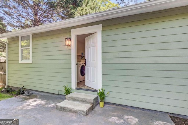 2572 Bates St SE, Smyrna, GA 30080 - doorway to property with independent washer and dryer and a patio area
