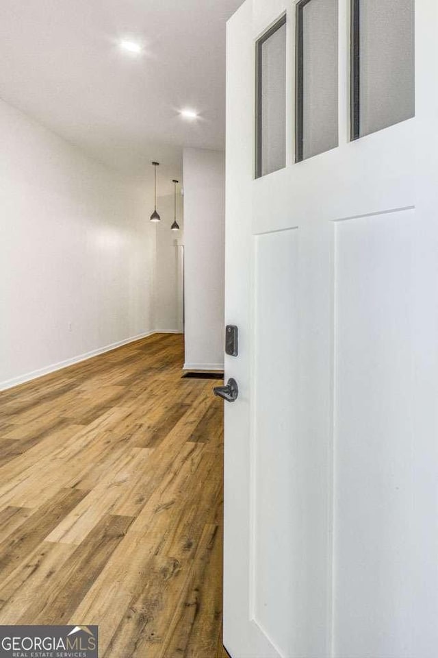 2572 Bates St SE, Smyrna, GA 30080 - empty room with wood finished floors, baseboards, and recessed lighting