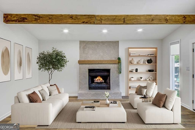 2572 Bates St SE, Smyrna, GA 30080 - living area featuring beam ceiling, wood finished floors, a large fireplace, and recessed lighting