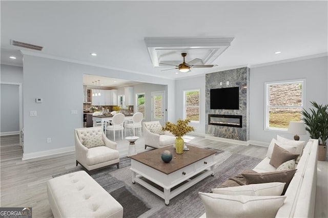 1226 Bloomsbury Ln, Gainesville, GA 30501 - living area featuring ornamental molding, recessed lighting, ceiling fan, light wood-style flooring, and a high end fireplace