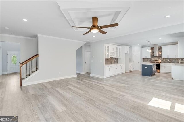 1226 Bloomsbury Ln, Gainesville, GA 30501 - unfurnished living room with a ceiling fan, light wood finished floors, stairway, ornamental molding, and recessed lighting