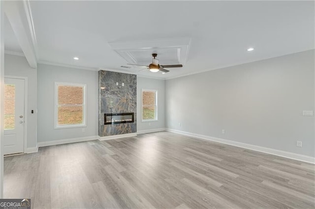 1226 Bloomsbury Ln, Gainesville, GA 30501 - unfurnished living room featuring crown molding, ceiling fan, wood finished floors, a premium fireplace, and recessed lighting