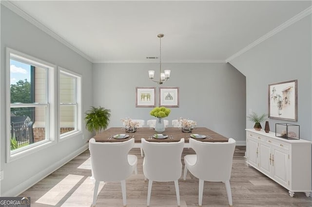 1226 Bloomsbury Ln, Gainesville, GA 30501 - dining room featuring a chandelier, light wood finished floors, and crown molding