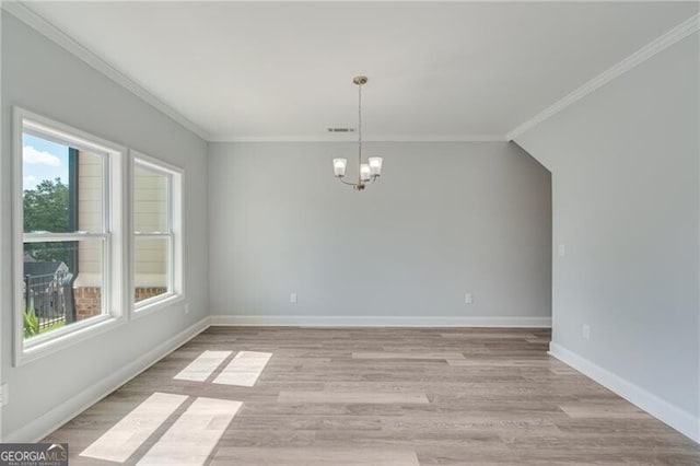 1226 Bloomsbury Ln, Gainesville, GA 30501 - unfurnished dining area featuring a chandelier, crown molding, and light wood-style flooring