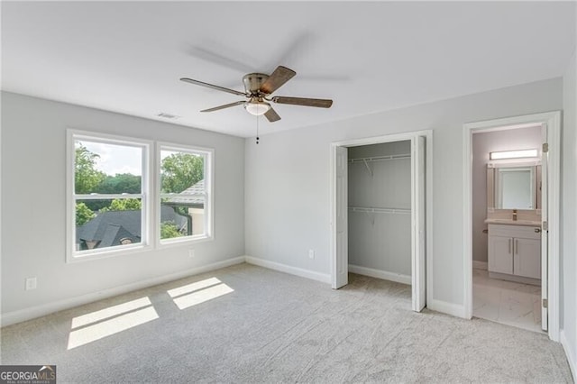 1226 Bloomsbury Ln, Gainesville, GA 30501 - unfurnished bedroom with light colored carpet, a closet, ensuite bathroom, and a ceiling fan