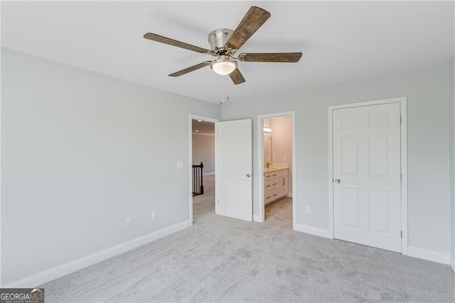 1226 Bloomsbury Ln, Gainesville, GA 30501 - unfurnished bedroom with light colored carpet, connected bathroom, and a ceiling fan