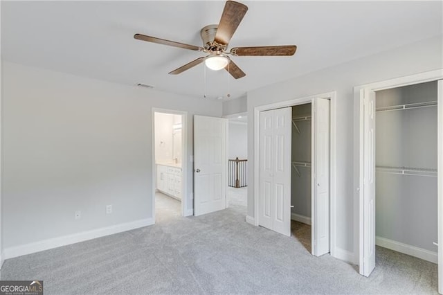1226 Bloomsbury Ln, Gainesville, GA 30501 - unfurnished bedroom with multiple closets, carpet floors, and a ceiling fan