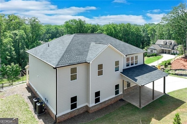 1226 Bloomsbury Ln, Gainesville, GA 30501 - back of property with a shingled roof and a patio area