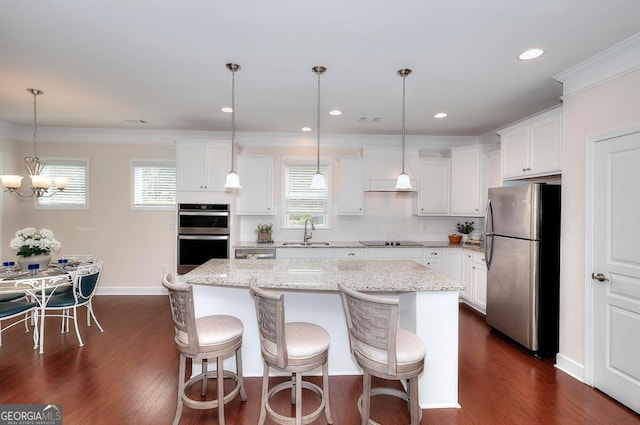 1391 Crooked Creek Rd, Greensboro, GA 30642 - kitchen featuring appliances with stainless steel finishes, a sink, a kitchen island, dark wood finished floors, and white cabinets