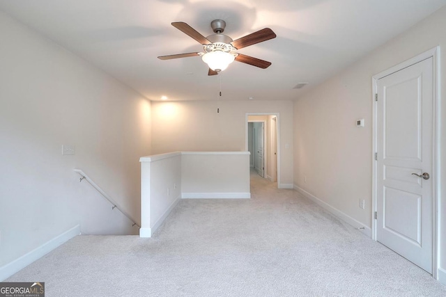 1391 Crooked Creek Rd, Greensboro, GA 30642 - spare room featuring light colored carpet, baseboards, and a ceiling fan