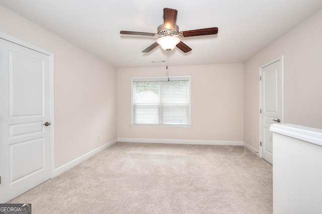 1391 Crooked Creek Rd, Greensboro, GA 30642 - unfurnished room with light carpet, baseboards, and a ceiling fan