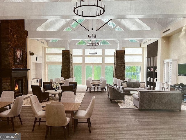 1391 Crooked Creek Rd, Greensboro, GA 30642 - dining space with high vaulted ceiling, a chandelier, beamed ceiling, and a warm lit fireplace