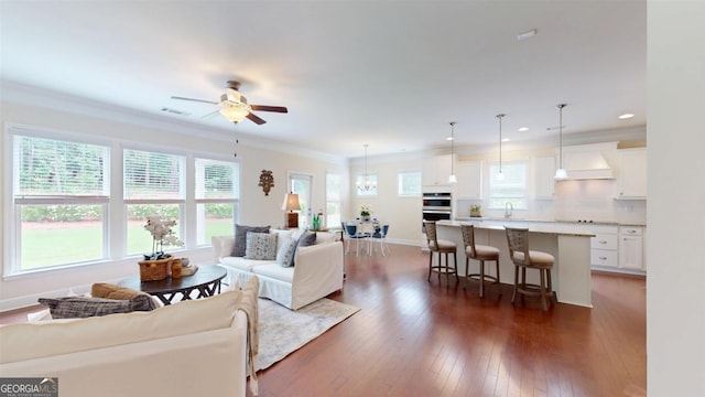 1391 Crooked Creek Rd, Greensboro, GA 30642 - living room featuring a ceiling fan, dark wood-style flooring, ornamental molding, baseboards, and recessed lighting