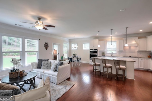 1391 Crooked Creek Rd, Greensboro, GA 30642 - living area featuring a ceiling fan, dark wood finished floors, baseboards, crown molding, and recessed lighting