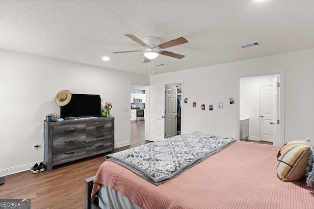 825 Red Hawk Dr, Waynesville, GA 31566 - bedroom with wood finished floors, recessed lighting, ceiling fan, a textured ceiling, and ensuite bathroom