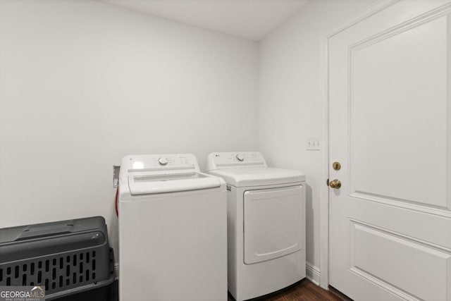 825 Red Hawk Dr, Waynesville, GA 31566 - laundry room with washer and clothes dryer and dark wood-style floors