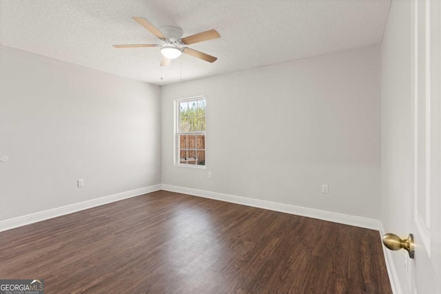 825 Red Hawk Dr, Waynesville, GA 31566 - spare room with dark wood-style floors, a ceiling fan, and a textured ceiling