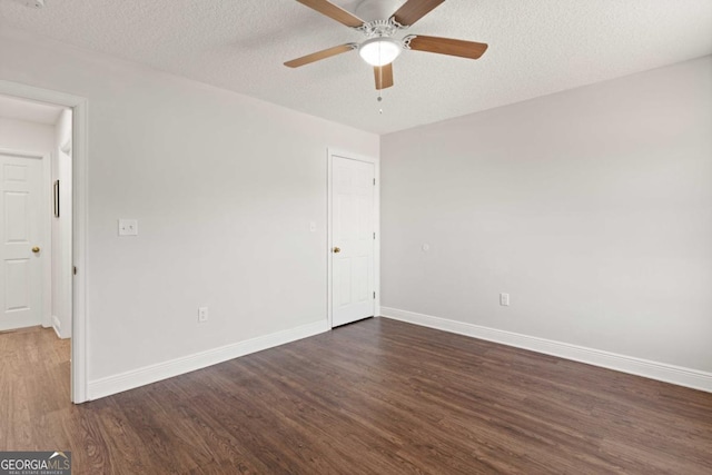 825 Red Hawk Dr, Waynesville, GA 31566 - spare room with dark wood-style floors, a ceiling fan, and a textured ceiling