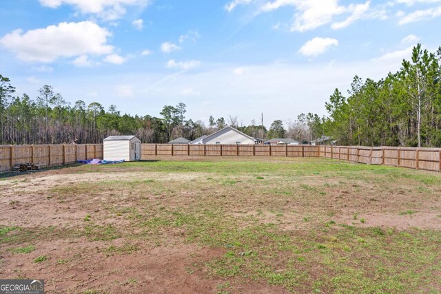 825 Red Hawk Dr, Waynesville, GA 31566 - fenced backyard featuring a shed