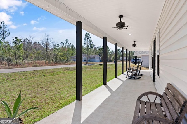 825 Red Hawk Dr, Waynesville, GA 31566 - porch featuring a yard and a ceiling fan