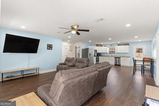 825 Red Hawk Dr, Waynesville, GA 31566 - living area featuring a ceiling fan, dark wood-type flooring, recessed lighting, and a textured ceiling