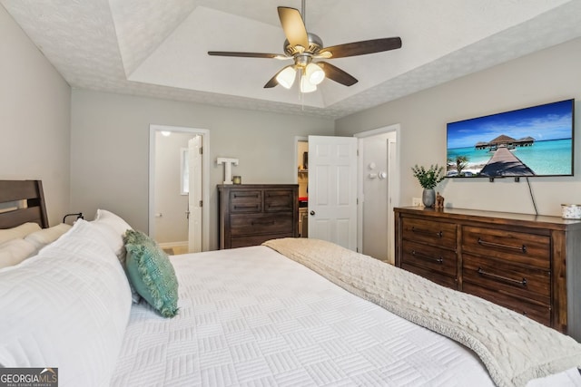 5519 Princeton Oaks Ln, Sugar Hill, GA 30518 - bedroom with a raised ceiling, ceiling fan, and baseboards