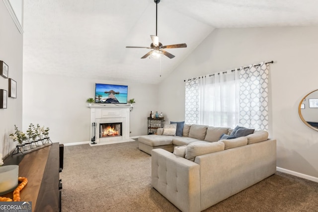 5519 Princeton Oaks Ln, Sugar Hill, GA 30518 - carpeted living area featuring ceiling fan, a glass covered fireplace, baseboards, and high vaulted ceiling