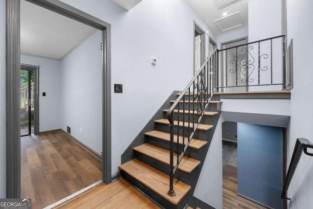 3664 Pin Oak Cir, Atlanta, GA 30340 - staircase featuring wood finished floors and attic access