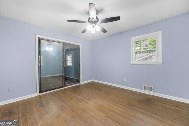 3664 Pin Oak Cir, Atlanta, GA 30340 - empty room featuring healthy amount of natural light, wood finished floors, and ceiling fan