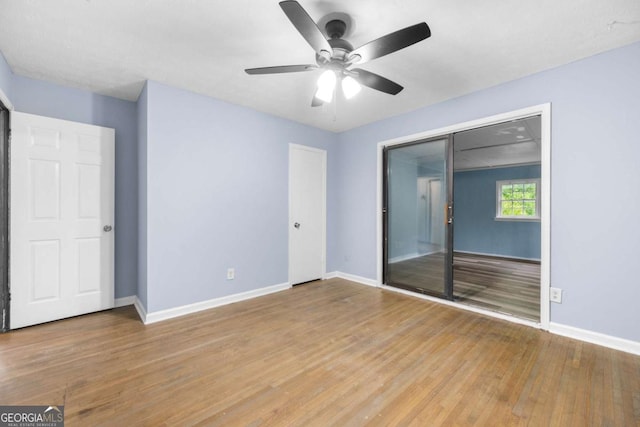 3664 Pin Oak Cir, Atlanta, GA 30340 - unfurnished bedroom with wood finished floors and a ceiling fan