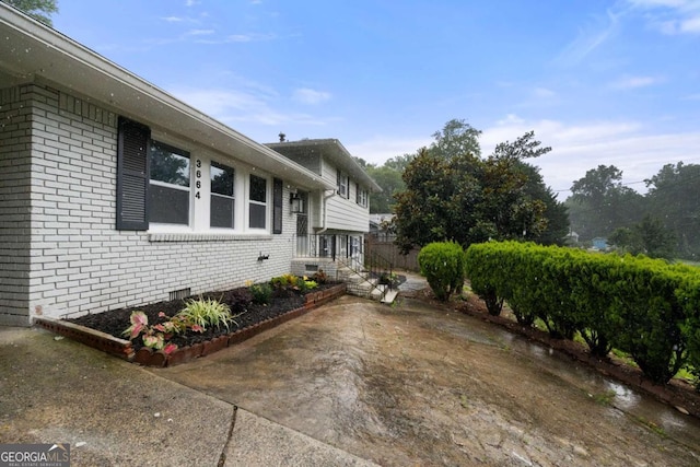 3664 Pin Oak Cir, Atlanta, GA 30340 - view of home's exterior with brick siding and crawl space