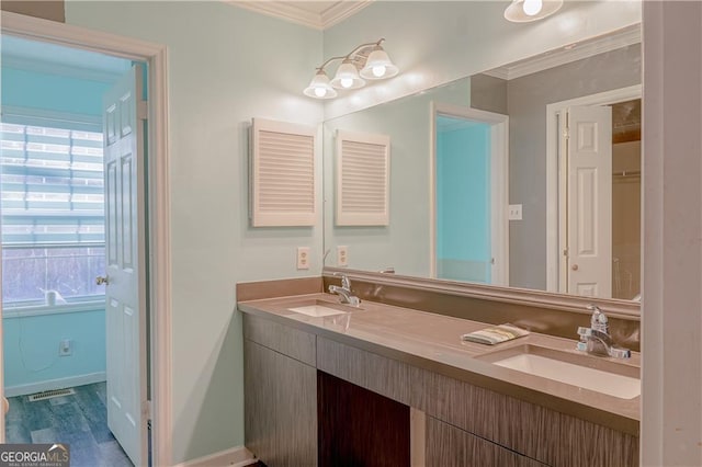 726 Mcdaniel Mill Rd SW, Conyers, GA 30094 - full bath featuring double vanity, plenty of natural light, crown molding, wood finished floors, and baseboards
