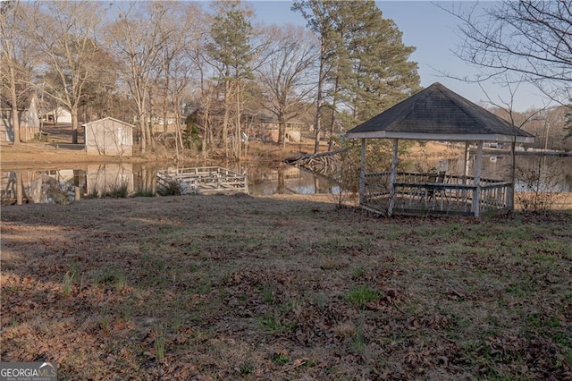 726 Mcdaniel Mill Rd SW, Conyers, GA 30094 - view of yard with a gazebo and a water view