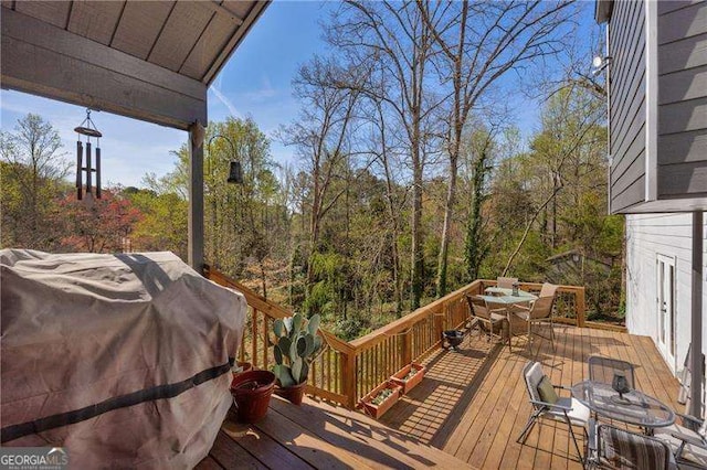 10845 Shallowford Rd, Roswell, GA 30075 - wooden terrace with outdoor dining area, grilling area, and a forest view