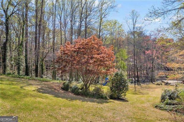 10845 Shallowford Rd, Roswell, GA 30075 - view of grassy yard featuring a wooded view