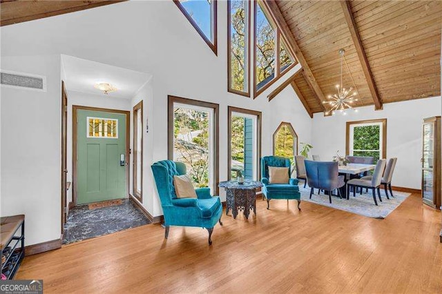 10845 Shallowford Rd, Roswell, GA 30075 - foyer featuring wood finished floors, a chandelier, high vaulted ceiling, and a wooden ceiling with exposed beams