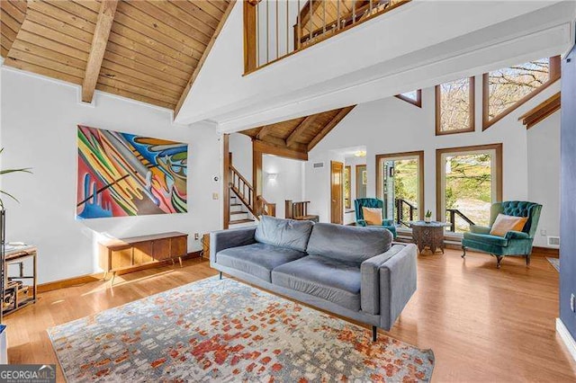 10845 Shallowford Rd, Roswell, GA 30075 - living room featuring high vaulted ceiling, a wood ceiling with exposed beams, wood finished floors, and stairway