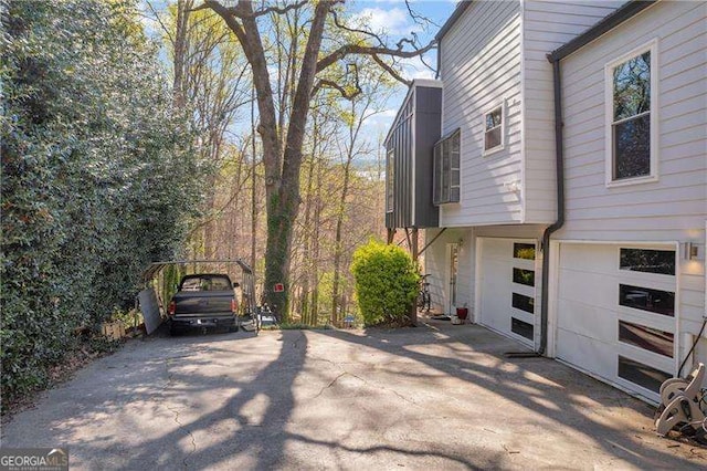 10845 Shallowford Rd, Roswell, GA 30075 - view of home's exterior featuring driveway and a garage