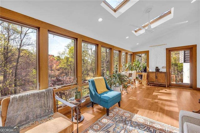 10845 Shallowford Rd, Roswell, GA 30075 - sunroom featuring a skylight, vaulted ceiling, wood finished floors, and recessed lighting