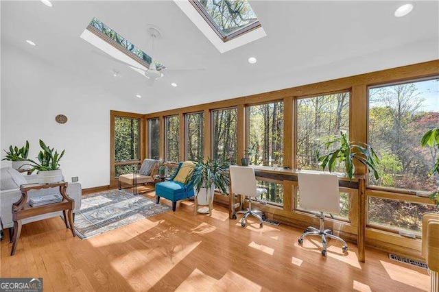 10845 Shallowford Rd, Roswell, GA 30075 - sunroom / solarium with a skylight, wood finished floors, recessed lighting, and high vaulted ceiling