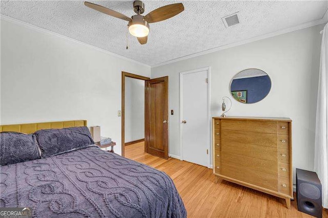 10845 Shallowford Rd, Roswell, GA 30075 - bedroom with wood finished floors, ornamental molding, a textured ceiling, and a ceiling fan