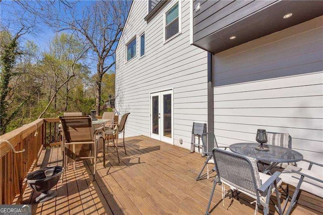 10845 Shallowford Rd, Roswell, GA 30075 - wooden deck with outdoor dining area and french doors