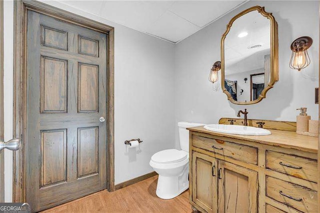 10845 Shallowford Rd, Roswell, GA 30075 - bathroom with vanity and wood finished floors