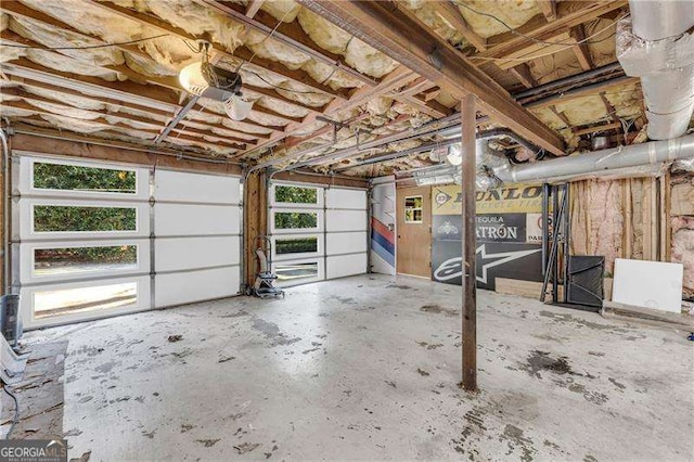 10845 Shallowford Rd, Roswell, GA 30075 - garage featuring a garage door opener