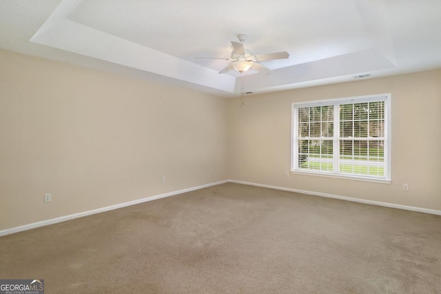 101 Coldbrook Cir, Rincon, GA 31326 - carpeted spare room with a tray ceiling and a ceiling fan