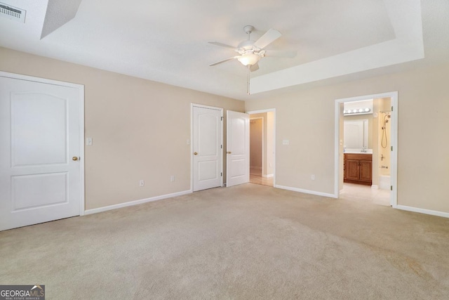 101 Coldbrook Cir, Rincon, GA 31326 - unfurnished bedroom with light carpet, connected bathroom, and a ceiling fan